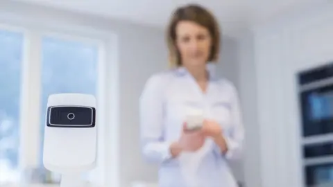 Getty Images woman in home with camera device