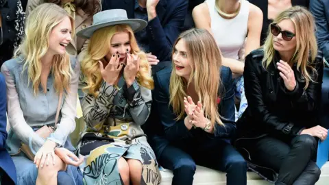Getty Images Poppy Delevingne, Paloma Faith, Cara Delevingne (Poppy's sister) and Kate Moss at London Fashion Week