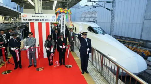 AFP/GETTY/JIJI PRESS A 50th anniversary ceremony for the Shinkansen bullet train was held in Tokyo in 2014.