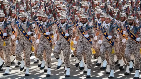 Getty Images Members of Iran's Islamic Revolutionary Guard Corp marching during a military parade