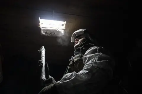 EPA A Ukrainian serviceman on a front line near the city of Donetsk last month.