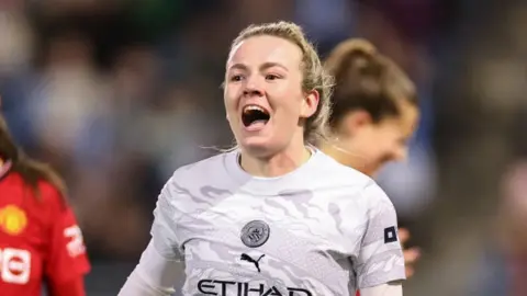 Manchester City's Lauren Hemp celebrates after scoring against Manchester United