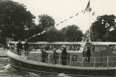 Jeff Morris The Queen aboard a lifeboat