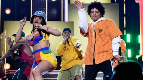 Getty Images Cardi B and Bruno Mars on stage at the Grammy Awards