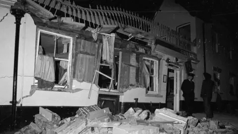 The aftermath of an IRA bomb at the Horse and Groom pub in Guildford, Surrey