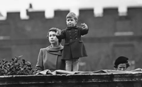 Getty Images Princess Elizabeth (later Queen Elizabeth II), left, and Prince Charles watching a procession, during the visit of Queen Juliana of the Netherlands, from the wall of Clarence House, London, 22nd November 1950.