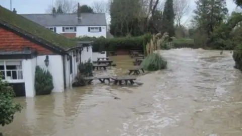 Sue Chalkley  River Bourne bursting its banks at East Peckham in 2014