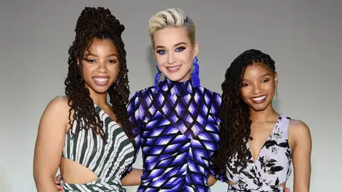 Getty Images Chloe Bailey, Katy Perry and Halle Bailey