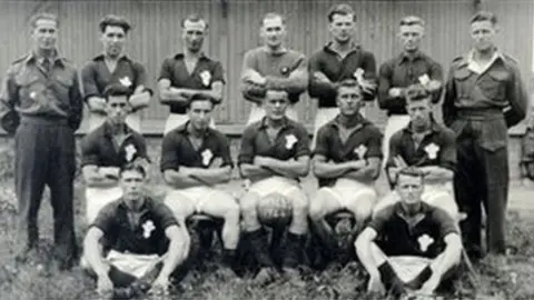 Ron Jones Wales football team at Auschwitz - Mr Jones is in the middle of the back row