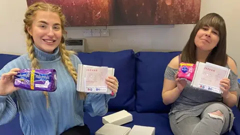 Right Resolution CIC Two women holding up a period pack