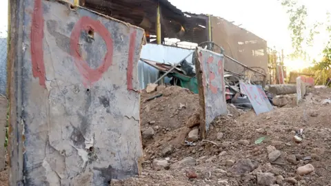 Dany Abi Khalil / BBC Makeshift graves in Omdurman