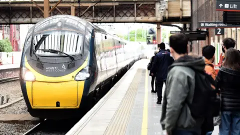 Getty Images West Coast Main Line passengers wait for Avanti train