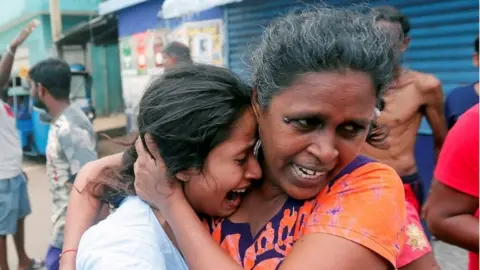 Reuters People who live near the church that was attacked yesterday, leave their houses as the military try to defuse a suspected van before it exploded in Colombo, Sri Lanka April 22, 2019.