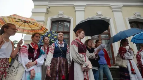 EPA Actors of the Kuplovsky theatre and friends attend a rally to support their strike as a protest against the discharge of theatre director Pavel Latushko in Minsk, Belarus, 19 August 2020.