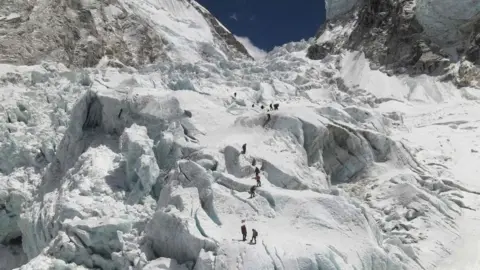 Getty Images Aerial picture showing climbers crossing the Khumbu icefall of Mount Everest, as seen from the Everest Base Camp