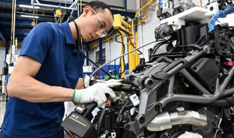 Getty Images A worker assembles a motorbike at the Northstar Precision Vietnam factory in Vinh Phuoc province