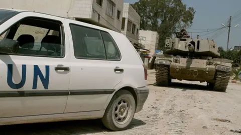 Getty Images UN vehicle and tank in Jenin (file photo)