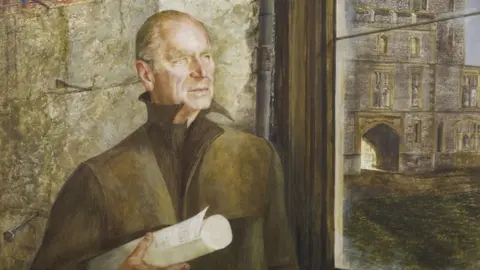 PA Media George A Weymouth's portrait of Philip standing in the shell of St George's Hall in the aftermath of the Windsor Castle blaze, holding a roll of floorplans