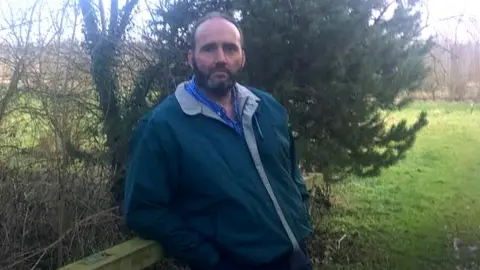 Phill Crawley Phill Crawley leaning on fence