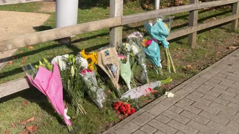 Flowers in tribute to Ms Nessa