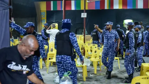 AFP Maldivian police entering the main opposition Maldivian Democratic Party (MDP) camp to break up celebrations of opposition supporters on 2 February 2018