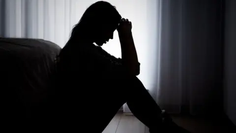 Getty Images depressed woman silhouette