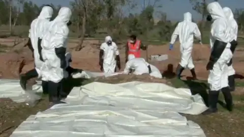 AFP/Getty Mass grave uncovered in eastern Syria