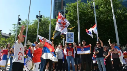 Getty Images Djokovic supporters protesting outside the court