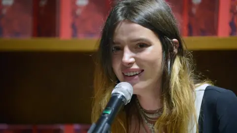 Getty Images Bella Thorne speaks and signs copies of her new book, "The Life of a Wannabe Mogul: Mental Disarray" in Florida, August 2019