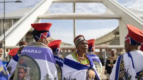 Getty Images Zulu women clad in traditional dresses arrive at the Moses Mabhida Stadium