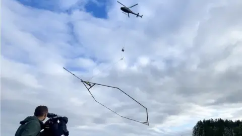 Helicopter with electromagnetic monitoring loop