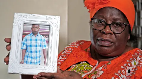 Angelina Patterson with picture of her son Charles