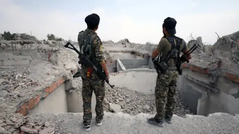 Reuters Syrian Democratic Forces (SDF) fighters in Raqqa on 16 September 2017