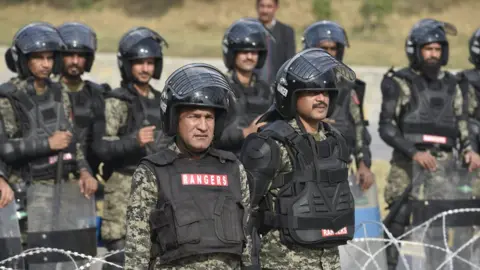 EPA Pakistani paramilitary soldiers take positions near to the supporters of religous group "Tehrik Labayk Ya Rasool Allah (TLYRA)" during a protest in Islamabad, Pakistan, 26 November 2017.
