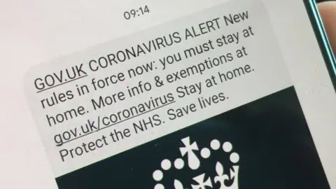 BBC Text message on a smartphone that says Coronavirus Alert