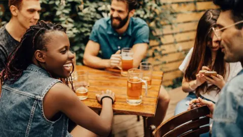 Group of people drinking at pub