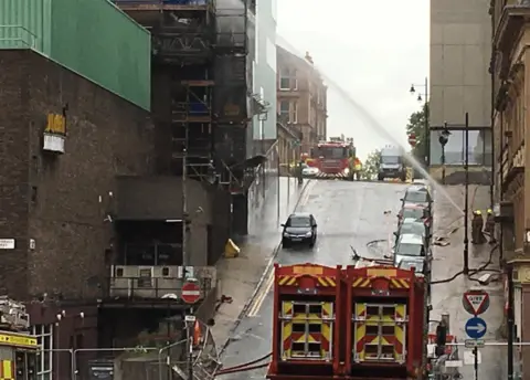 BBC fire hoses running through city