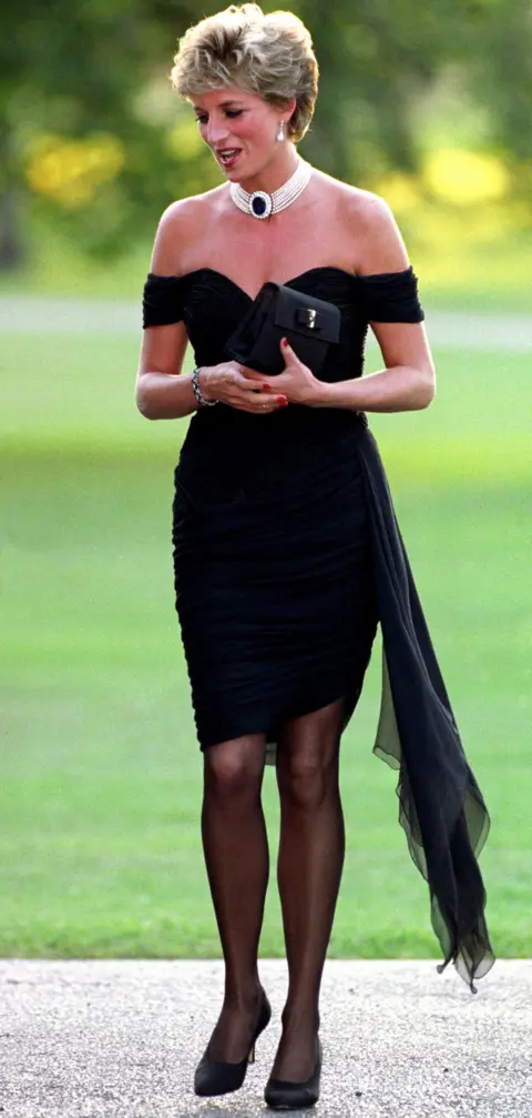 PA Diana, Princess of Wales wearing a black pleated chiffon dress, with floating side panel, by Christina Stamboulian, during a party given at the Serpentine Gallery in London.