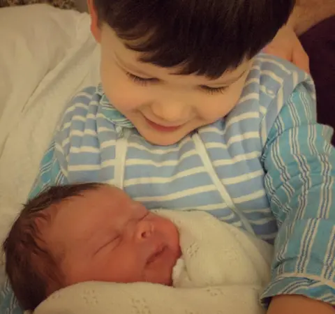 Emily Mead Edward, 2, meeting Margot Louisa Mary after she was born on Valentine's Day this year. "To say he was besotted is an understatement," their mum said