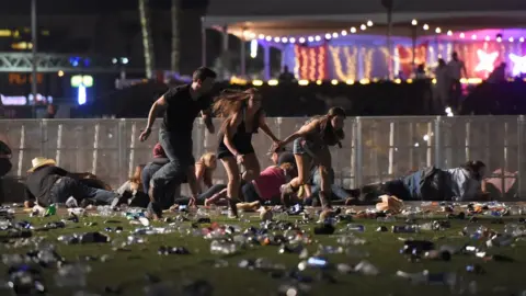 Getty Images People fled in panic from the music festival