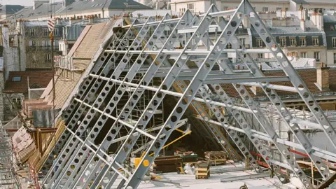 Wilmotte & Associés The roof of the gothic religious building, Collège des Bernardins in the midst of a reconstruction effort by Jean-Michel Wilmotte