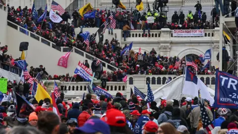 The Washington Post via Getty Images Photo of protestors storming the US Capitol on 6 January 2021