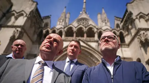 Press Eye Barry McCaffrey and Trevor Birney outside the Royal Courts in London