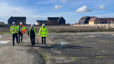 Essex County Council Councillor Andrew Sheldon and Councillor Tony Ball, Essex County Council, Mark Francois MP and William Wood, Associate Director of Planning, Vistry Major Projects.