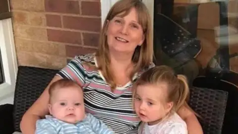 Family photo Emily's children with their grandmother before lockdown