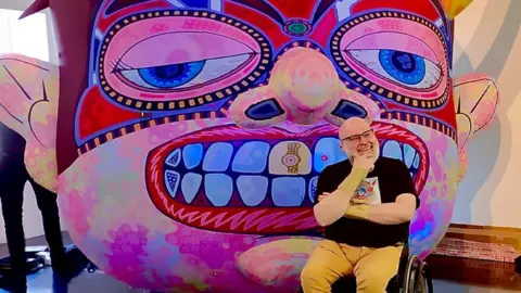 Ferens Art Gallery Artist pictured with one of the exhibits