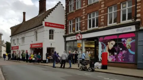 Queues of people outside stores in North Walsham