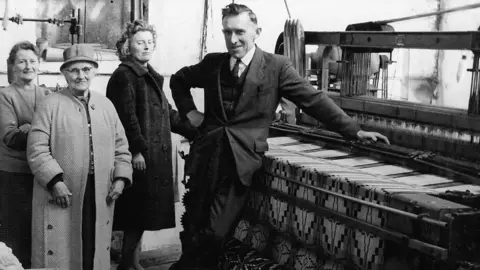 Melin Tregwynt Archive Eifion's father (right) with three visitors to the mill