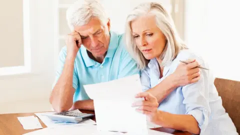 Getty Images Couple looking at forms.