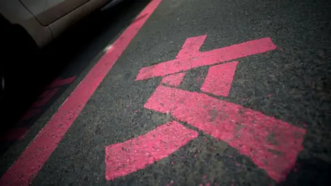 Getty Images This photo taken on July 7, 2014 shows the Chinese character 'nu' meaning woman